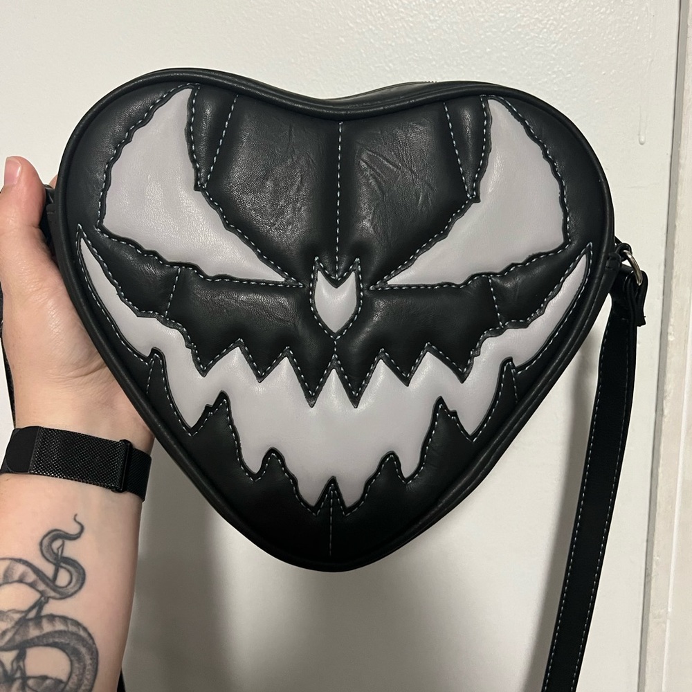 Love pain and stitches purse